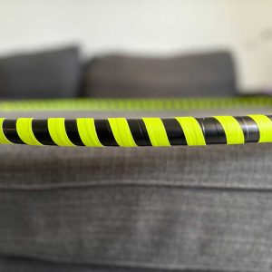 Hoop taped with black base color and bright yellow reactive tape.