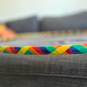 Multi-colored hoop with crosshatch patter of royal blue, green, yellow, red and orange