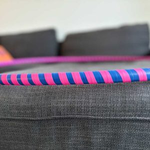 Hoop with blue tape base color and bright pink, reactive tape.